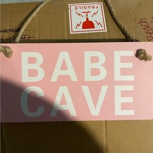 Babe Cave sign.